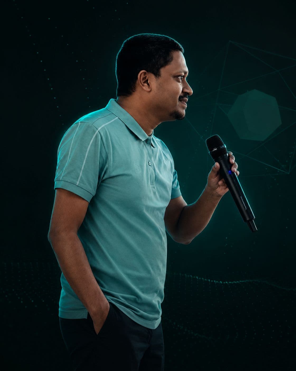 Shahamar Rahman speaking into a microphone